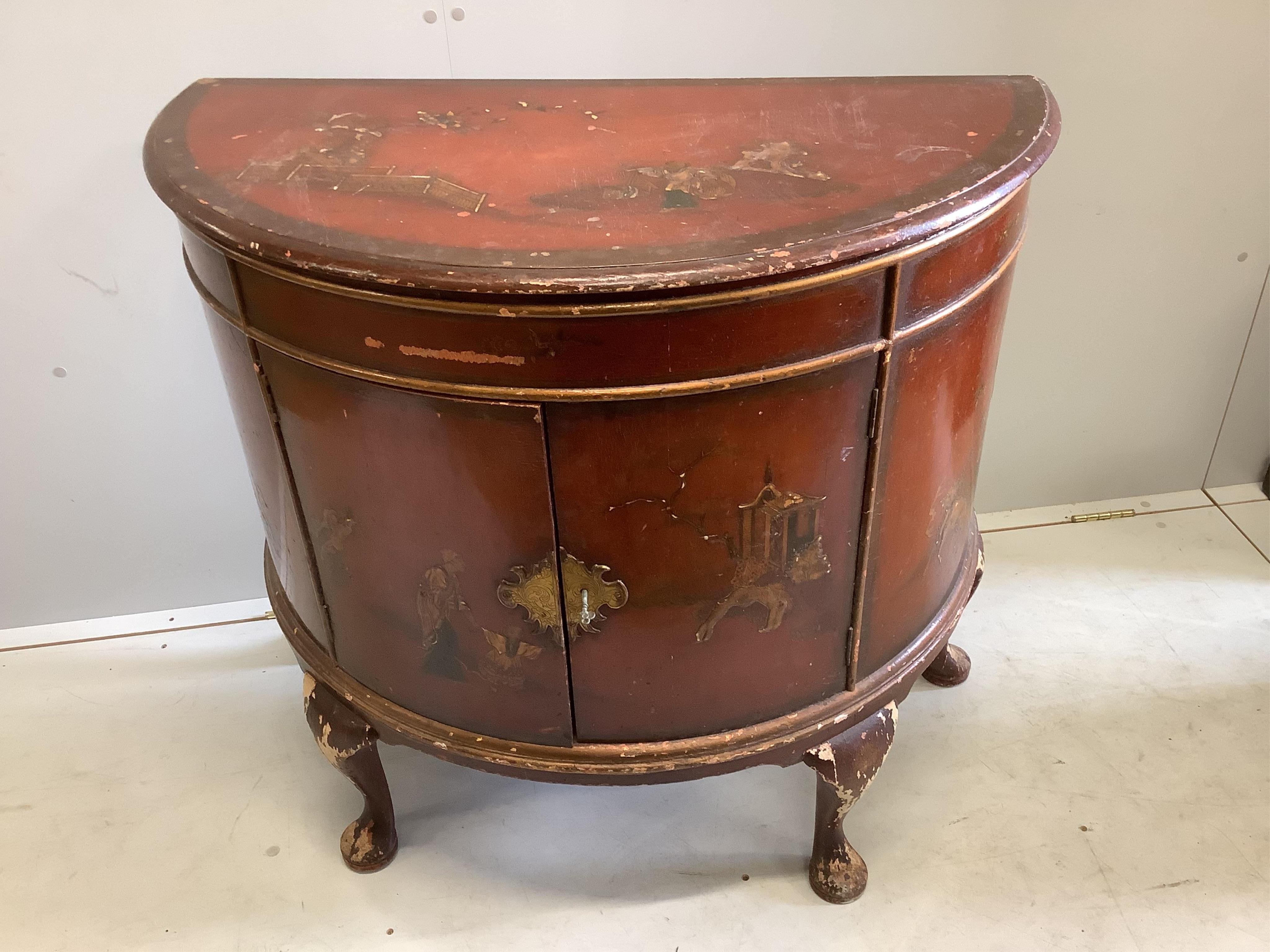 An early 20th century scarlet chinoiserie lacquer D shaped side cabinet, width 95cm, depth 49cm, height 86cm. Condition - poor